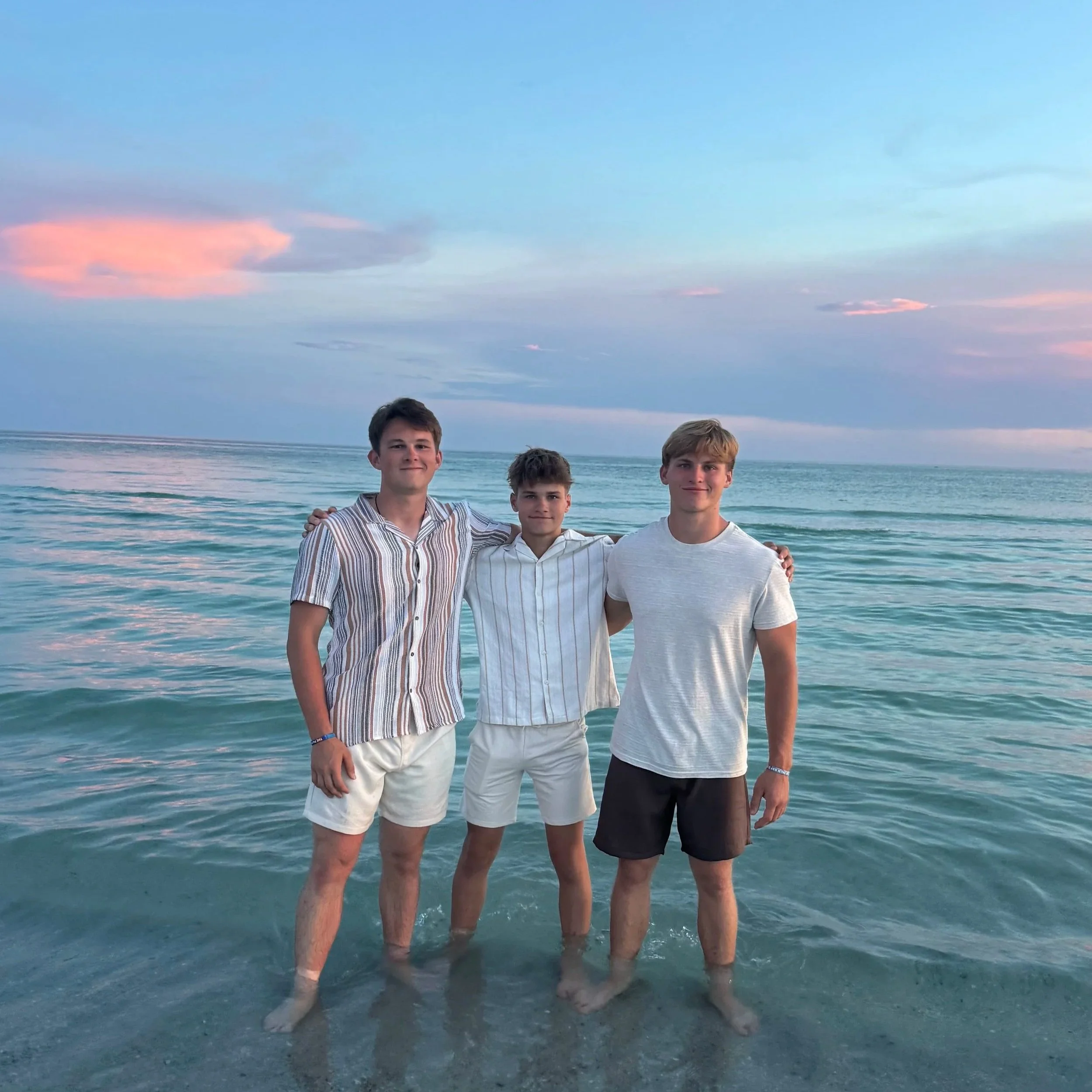 The three brothers together outside